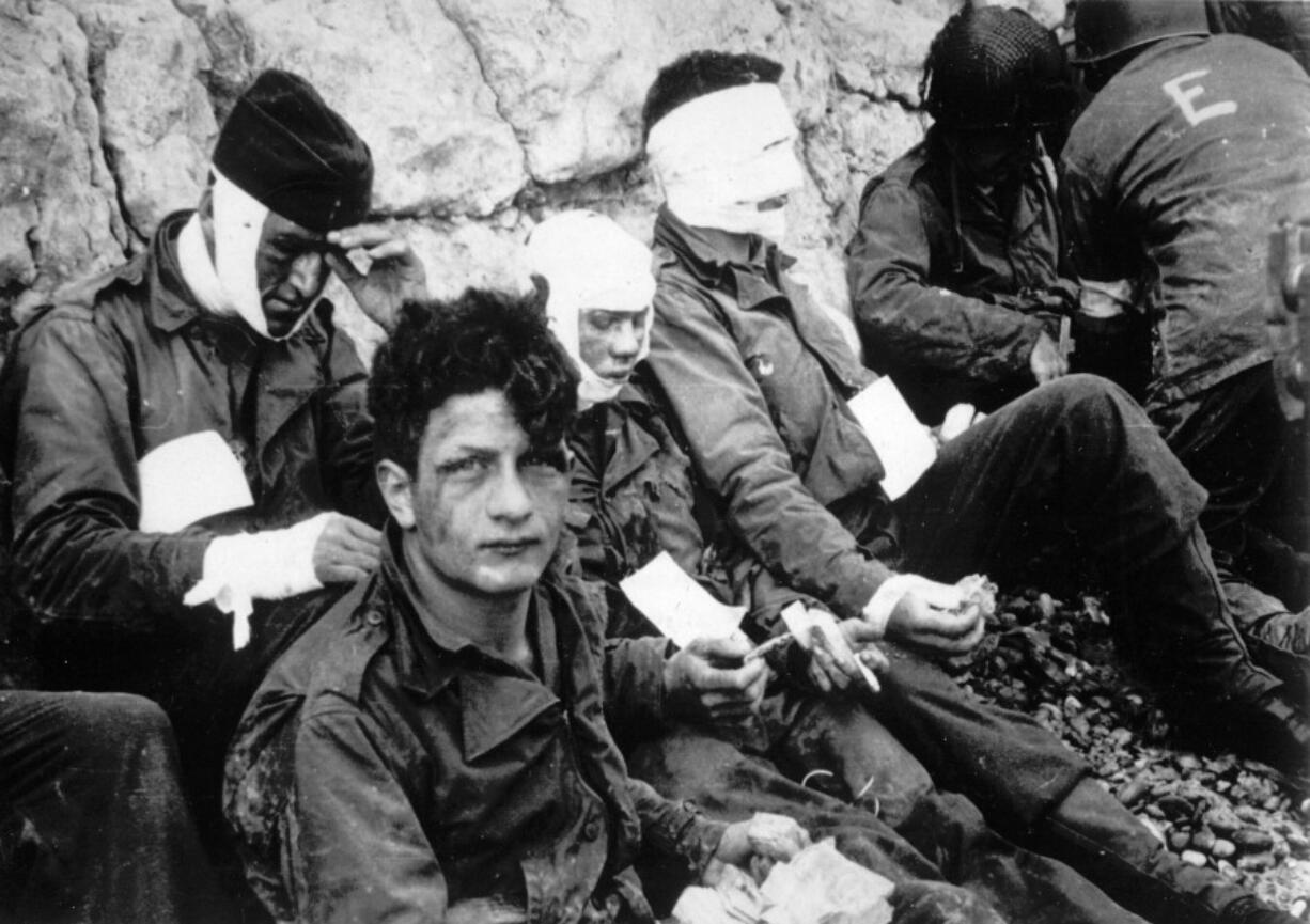 Men of the American assault troops of the 16th Infantry Regiment, injured while storming a coastal area code-named Omaha Beach during the Allied invasion of the Normandy, wait by the chalk cliffs at Collville-sur-Mer for evacuation to a field hospital for further treatment, June 6, 1944. On D-Day, Charles Shay was a 19-year-old Native American army medic who was ready to give his life &mdash; and actually saved many. Now 99, he&rsquo;s spreading a message of peace with tireless dedication as he&rsquo;s about to take part in the 80th celebrations of the landings in Normandy that led to the liberation of France and Europe from Nazi Germany occupation.