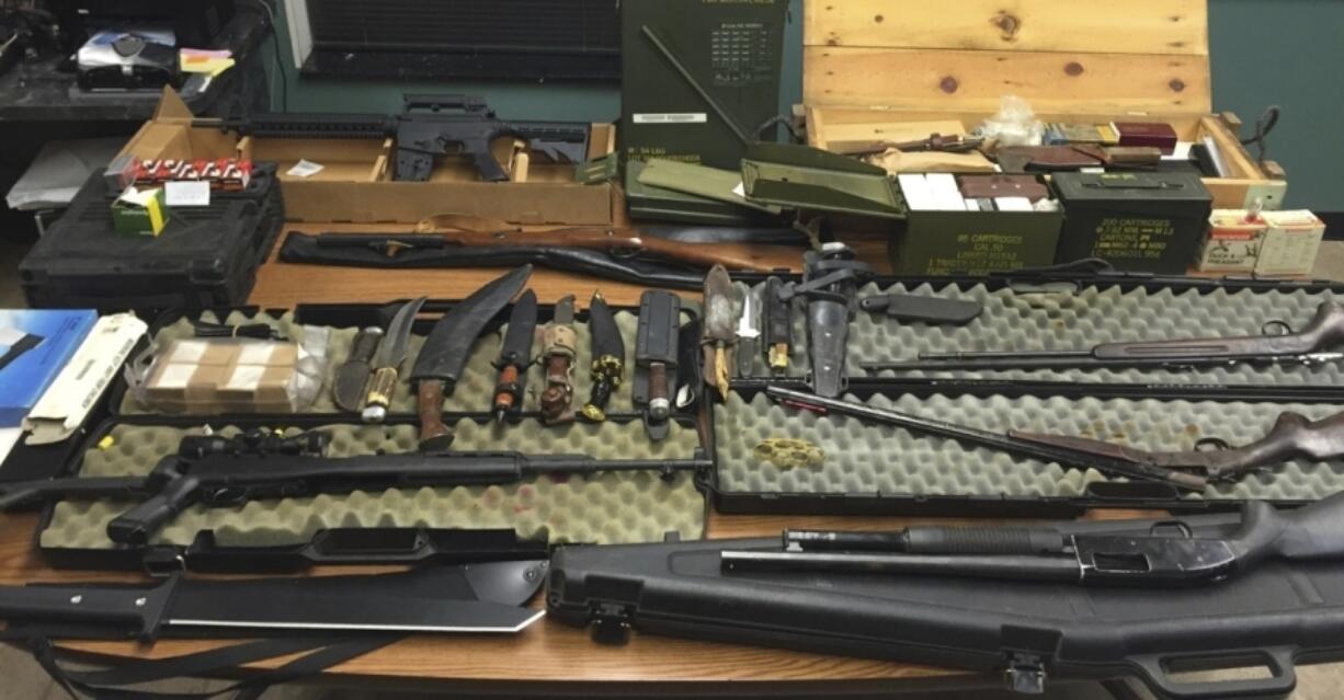 FILE - This undated photo provided by the Van Buren County Sheriff&rsquo;s Office in Paw Paw, Mich., shows stolen guns, ammunition and knives that were recovered Sept. 12, 2015, in Antwerp Township, Mich. The rate of guns stolen from cars in the U.S. has tripled over the last decade, making them the largest source of stolen guns in the country, a new analysis of FBI data by the gun-safety group Everytown found.