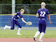 Heritage's Skyler Jones, left, catches the ball on the run in left field during the Class 3A state softball round of 16 against Ballard on Friday, May 24, 2024, at Regional Athletic Complex in Lacey.