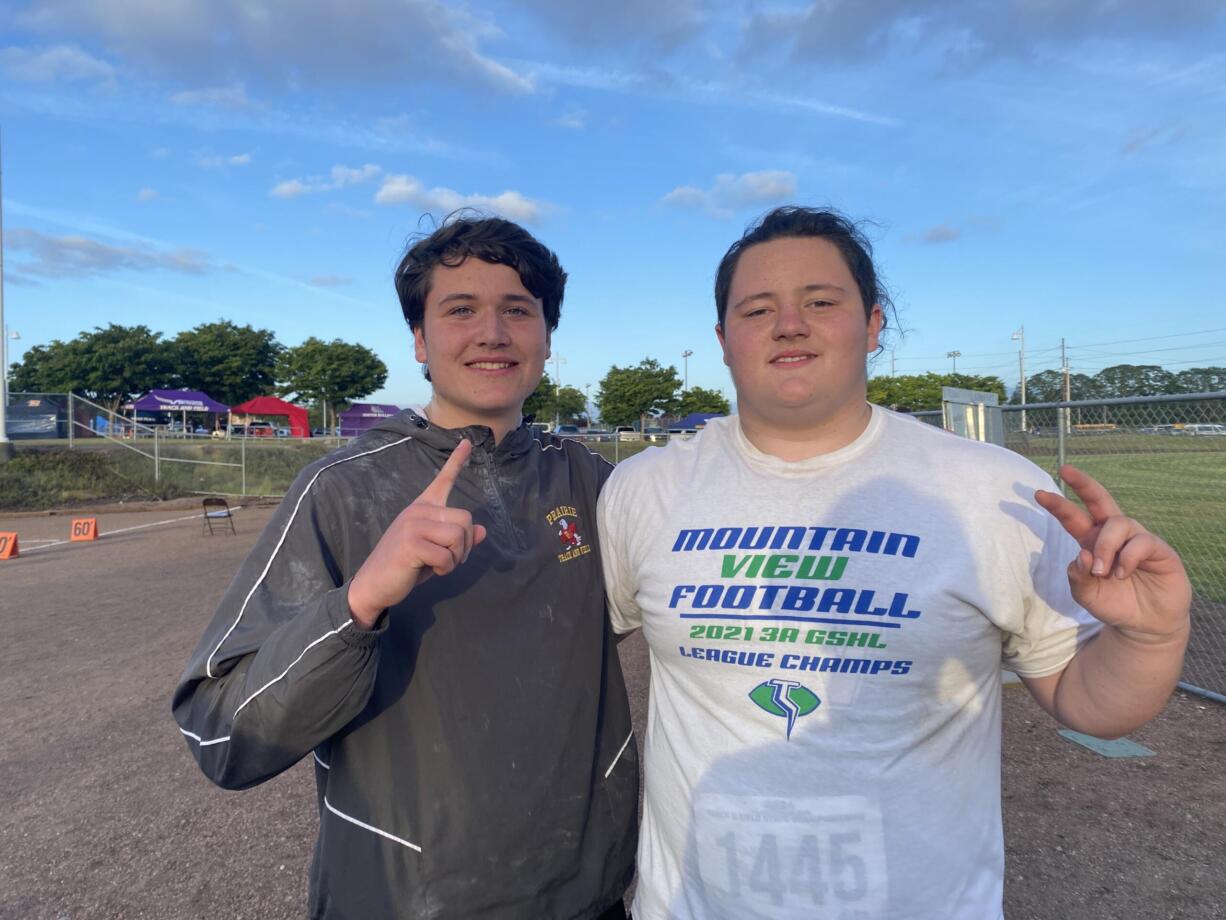 Prairie's Will Foster (left) and Mountain View's Juan Pasillas-Stanton pose for a photo after going 1-2 in the Class 3A boys shot put on Thursday at Mount Tahoma High School. The 3A GSHL went 1-2-4 in the event.