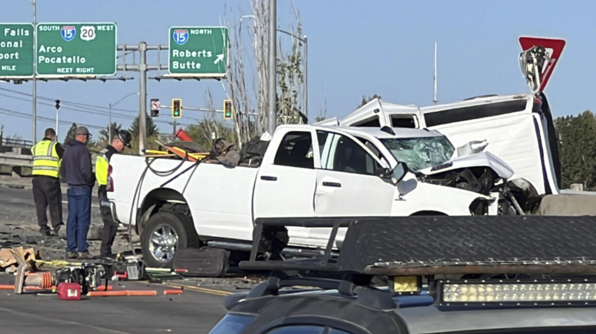In this file photo provided by KIFI Local News 8, a pickup truck crashed into a passenger van on U.S. Highway 20, Saturday, May 18, 2024, in Idaho Falls, Idaho.  The six people killed when a pickup crashed into a passenger van in Idaho over the weekend were agricultural workers from Mexico, officials said.