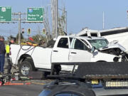 In this file photo provided by KIFI Local News 8, a pickup truck crashed into a passenger van on U.S. Highway 20, Saturday, May 18, 2024, in Idaho Falls, Idaho.  The six people killed when a pickup crashed into a passenger van in Idaho over the weekend were agricultural workers from Mexico, officials said.