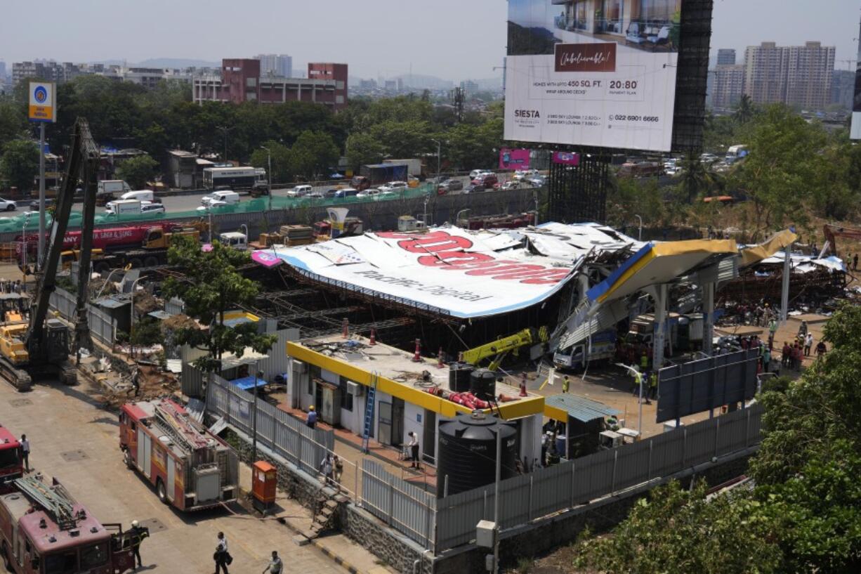 A general view of a large billboard that collapsed Monday evening following heavy rain and thundershowers at Ghatkopar, a suburb of Mumbai, India, Tuesday, May 14, 2024. More than a dozen people were killed and dozens more were injured in the accident.
