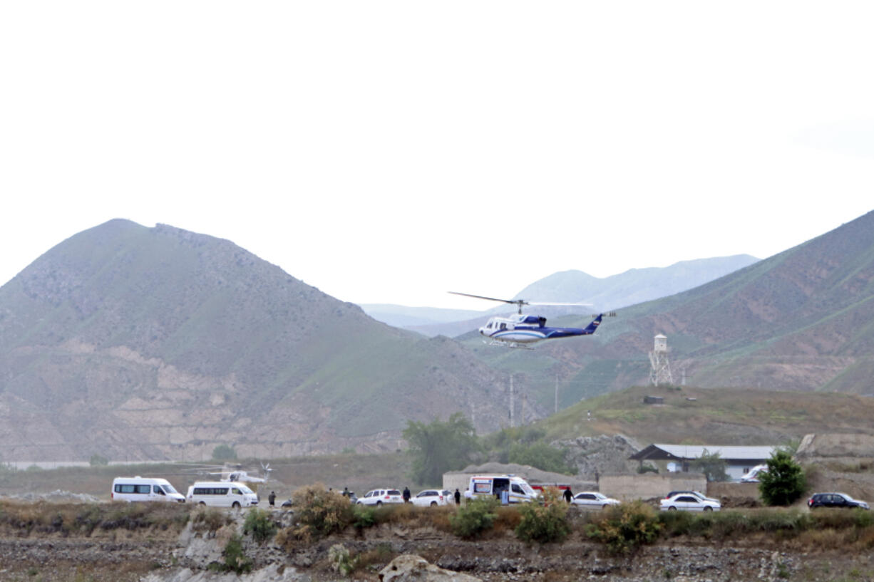 In this photo provided by Islamic Republic News Agency, IRNA, the helicopter carrying Iranian President Ebrahim Raisi takes off at the Iranian border with Azerbaijan after President Raisi and his Azeri counterpart Ilham Aliyev inaugurated dam of Qiz Qalasi, or Castel of Girl in Azeri, Iran, Sunday, May 19, 2024. A helicopter carrying President Raisi suffered a &quot;hard landing&quot; on Sunday, Iranian state media reported, without elaborating.