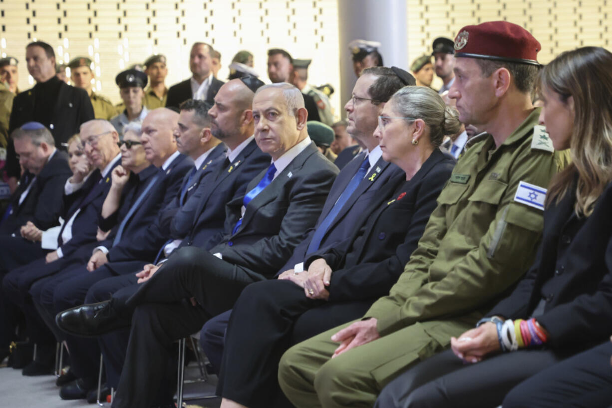 Israel&rsquo;s Prime Minister Benjamin Netanyahu, fifth right, President Isaac Herzog, fourth right, First Lady Michal Herzog, third right, and Israeli army chief Herzi Halevi, second right, attend a ceremony marking Memorial Day for fallen soldiers of Israel&rsquo;s wars and victims of attacks at Jerusalem&rsquo;s Mount Herzl military cemetery Monday, May 13, 2024.