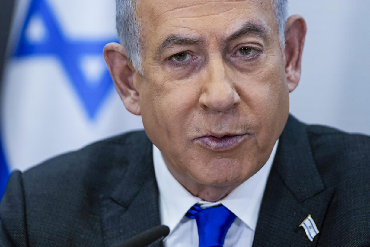 FILE - Israeli Prime Minister Benjamin Netanyahu chairs a cabinet meeting at the Kirya military base, which houses the Israeli Ministry of Defense, in Tel Aviv, Israel, on Dec. 24, 2023. Netanyahu has repeatedly accused critics of Israel or his policies of antisemitism, including the U.S. college campus protests and the prosecutor of the International Criminal Court.