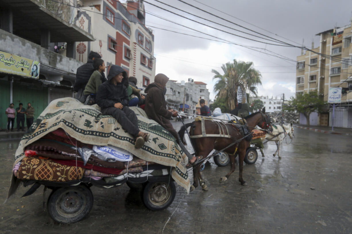 Palestinians flee from the eastern side of the southern Gaza city of Rafah after the Israeli army orders them to evacuate ahead of a military operation, in Rafah, Gaza Strip, Monday, May 6, 2024. The order affects tens of thousands of people and could signal a broader invasion of Rafah, which Israel has identified as Hamas&rsquo; last major stronghold after seven months of war.