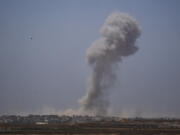 Smoke billows after an explosion in the Gaza Strip, as seen from southern Israel Tuesday, May 21, 2024.