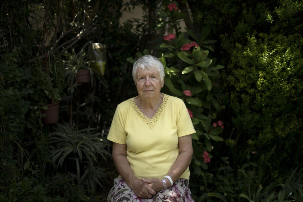 Judith Tzamir, a Holocaust survivor from Germany, poses for a portrait in her family home in Kibbutz Meflasim, southern Israel, Friday, May 3, 2024. On Monday, Tzamir will join 55 other Holocaust survivors from Israel and around the world for a memorial march in Poland, called March of the Living.