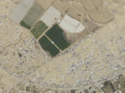 This satellite photo taken by Planet Labs PBC shows an evacuated camp in Rafah, Gaza, May 8, 2024.