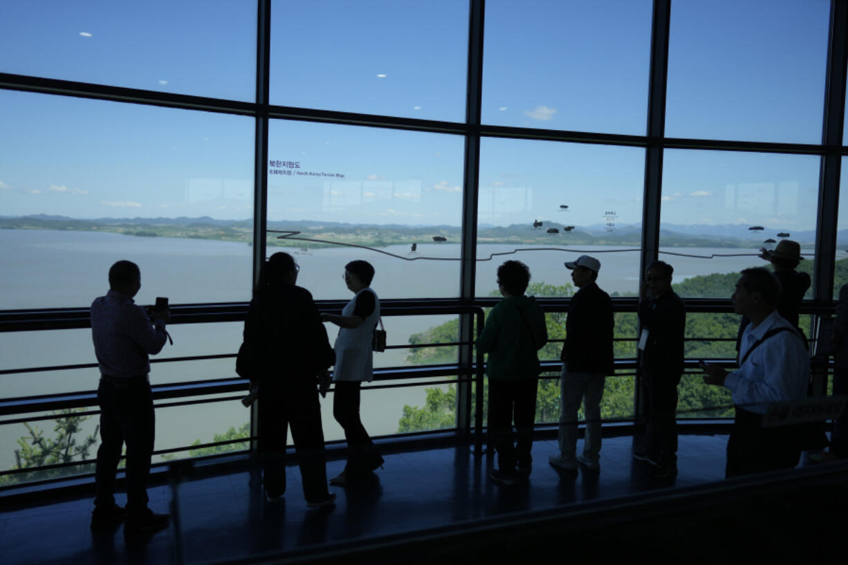 Visitors look at the North Korean side from the unification observatory in Paju, South Korea, Tuesday, May 28, 2024. A rocket launched by North Korea to deploy the country&rsquo;s second spy satellite exploded shortly after liftoff Monday, state media reported, in a setback for leader Kim Jong Un&rsquo;s hopes to operate multiple satellites to better monitor the U.S. and South Korea.