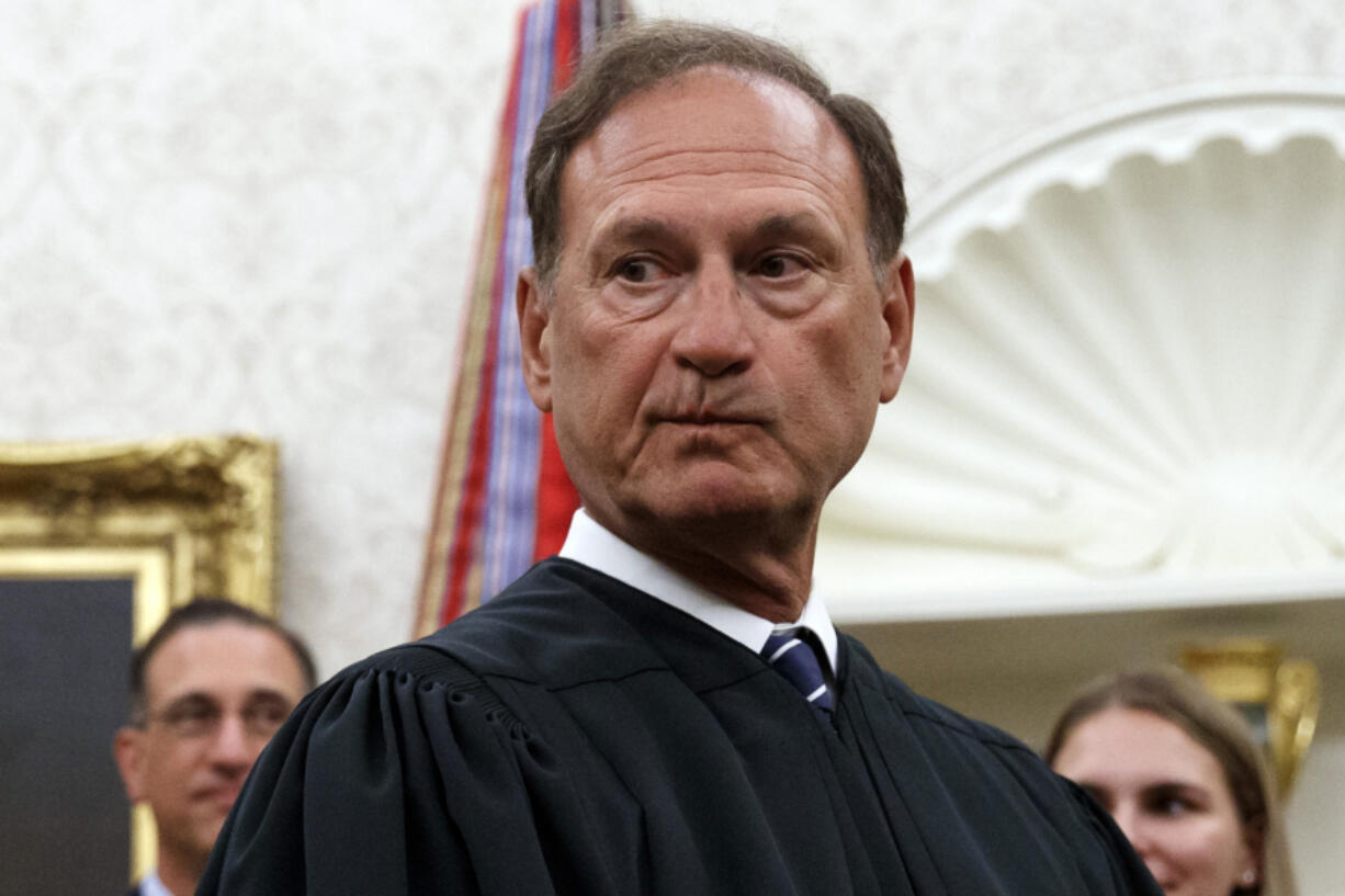 FILE - Supreme Court Justice Samuel Alito pauses after swearing in Mark Esper as Secretary of Defense during a ceremony with President Donald Trump in the Oval Office at the White House in Washington, July 23, 2019. Nine days after The New York Times reported about the political symbolism of an upside-down American flag that flew at U.S. Supreme Court Justice Samuel Alito&rsquo;s home, the Washington Post acknowledged May 25, 2024, that it had the same story more than three years ago and decided not to publish it.