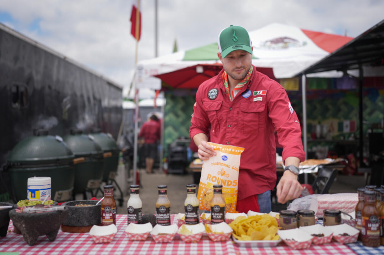 Juventino Alanis of the Sociedad Mexicano de Parrillieros team prepares food for tasting at the World Championship Barbecue Cooking Contest, Friday, May 17, 2024, in Memphis, Tenn.