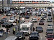 Cars drive through Hartsfield-Jackson Atlanta International Airport ahead of Memorial Day, Friday, May 24, 2024, in Atlanta.(AP Photo/Mike Stewart)