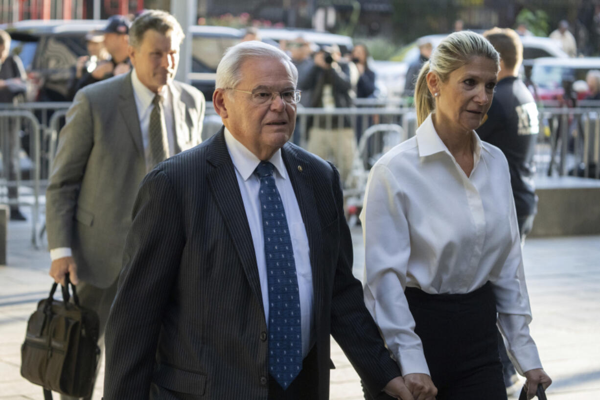 FILE - Democratic U.S. Sen. Bob Menendez of New Jersey and his wife Nadine Menendez arrive at the federal courthouse in New York, Sept. 27, 2023. Menendez said Thursday, May 16, 2024, that his wife has breast cancer and will require a mastectomy, a revelation made just as the presentation of evidence began at his New York bribery trial.