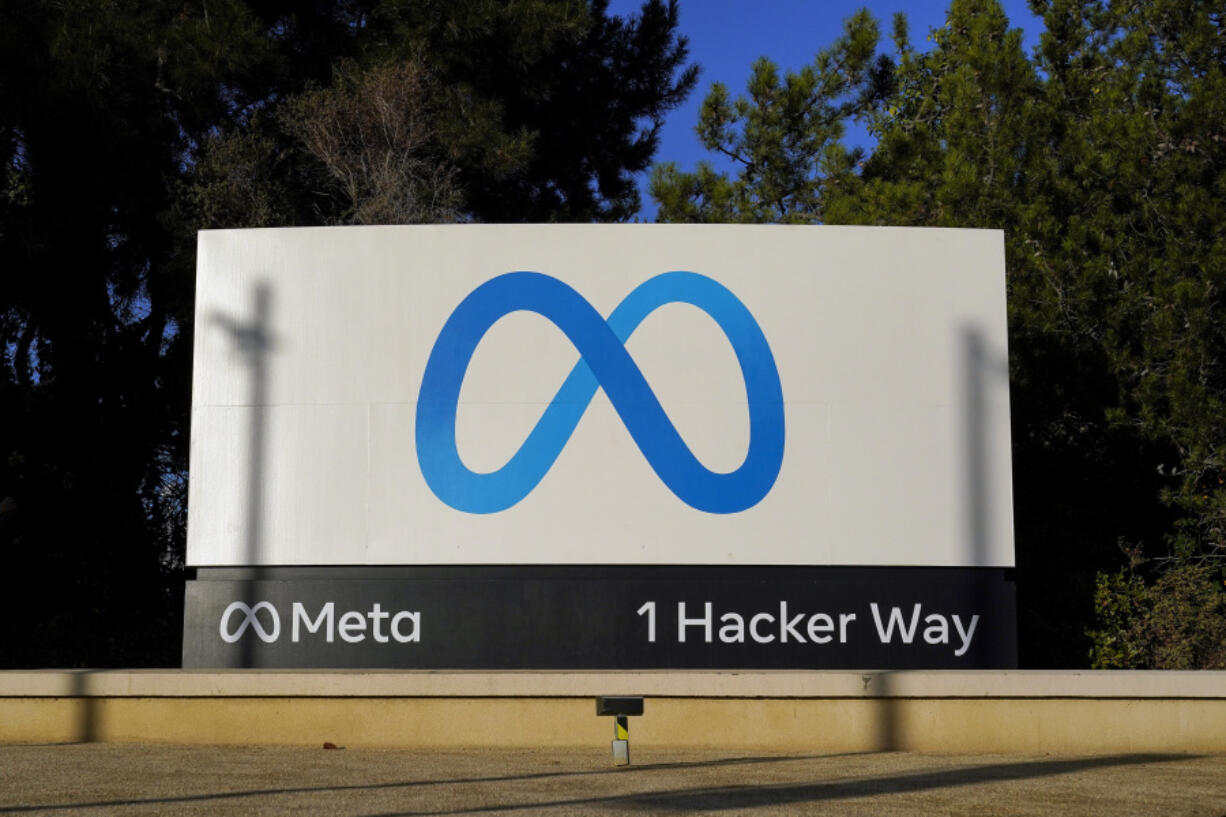 FILE - Meta&rsquo;s logo is seen on a sign at the company&rsquo;s headquarters in Menlo Park, Calif., Nov. 9, 2022. A lawsuit filed Wednesday, May 1, 2024, against Facebook parent Meta Platforms Inc. is arguing that a federal law often used to shield internet companies from liability also allows people to use external tools to take control of their feed &mdash; even if that means shutting it off entirely. (AP Photo/Godofredo A.