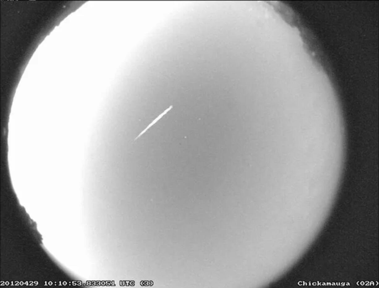 This photo provided by NASA shows an Eta Aquarid meteor streaking over northern Georgia on April 29, 2012. The Eta Aquarid meteor shower peaks this weekend. Astronomers say it should be visible in both hemispheres. (B.