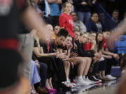 FILE - Players and staff on the Utah bench react toward the end of a second-round college basketball game against Gonzaga in the NCAA Tournament in Spokane, Wash., Monday, March 25, 2024. A northern Idaho prosecutor won&rsquo;t bring hate crime charges against an 18-year-old accused of shouting a racial slur at members of the Utah women&rsquo;s basketball team while the team was in Idaho to attend the NCAA Tournament.