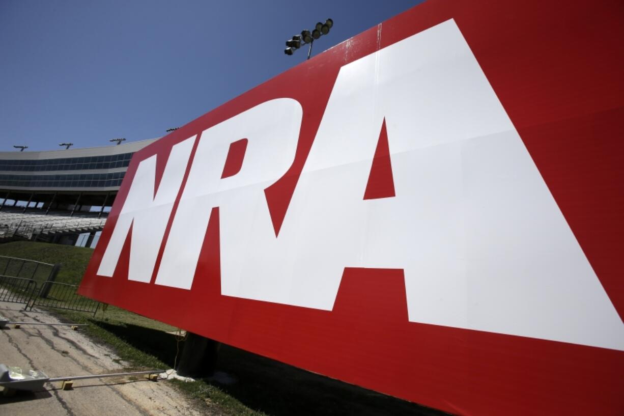 FILE - An NRA sign is seen outside the track of the NASCAR Sprint Cup series, Friday April 12, 2013. The National Rifle Association is kicking off its annual meeting Friday, May 17, 2024, in downtown Dallas, gathering for the first time in decades without Wayne LaPierre at the helm, as board members prepare to elect his replacement.