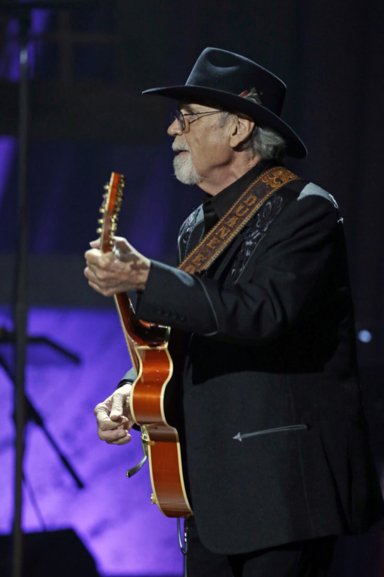 FILE - Duane Eddy performs during the Americana Music Honors and Awards show, Sept. 18, 2013, in Nashville, Tenn. Eddy, a pioneering guitar hero whose reverberating electric sound on instrumentals such as &quot;Rebel Rouser&quot; and &ldquo;Peter Gunn&rdquo; helped put the twang in early rock &#039;n&#039; roll and influenced George Harrison, Bruce Springsteen and countless other musicians, died of cancer Tuesday, April 30, 2024. He was 86.