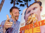 FILE - Morgan Spurlock poses at the Los Angeles premiere of his film &ldquo;Super Size Me,&rdquo; Thursday night, April 22, 2004, in the Hollywood section of Los Angeles. Spurlock, an Oscar-nominee who made food and American diets his life&rsquo;s work, famously eating only at McDonald&rsquo;s for a month to illustrate the dangers of a fast-food diet, has died. He was 53. (AP Photo/Mark J.