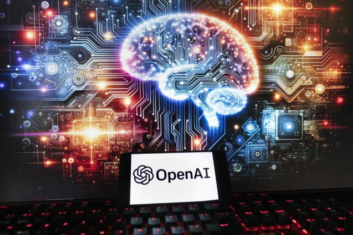 FILE - The OpenAI logo is seen displayed on a cell phone with an image on a computer monitor generated by ChatGPT&rsquo;s Dall-E text-to-image model, Friday, Dec. 8, 2023, in Boston. OpenAI says it&rsquo;s setting up a new safety and security committee and has begun training a new artificial intelligence model to supplant the GPT-4 system that underpins its ChatGPT chatbot. The San Francisco startup said in a blog post Tuesday May 28, 2024 that the committee will advise the full board on &ldquo;critical safety and security decisions&rdquo; for its projects and operations.