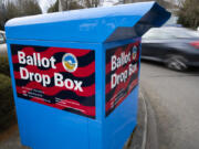 A car drives by a ballot drop box on Wednesday, March 6, 2024, in Sherwood, Ore. In Oregon&rsquo;s Multnomah County, home to Portland, the progressive district attorney who took office during the historical social justice movement of 2020 is being challenged by a more centrist candidate vowing to be tough on crime, highlighting the growing pressure on liberal prosecutors across the U.S. amid voter concerns over public drug use and disorder.