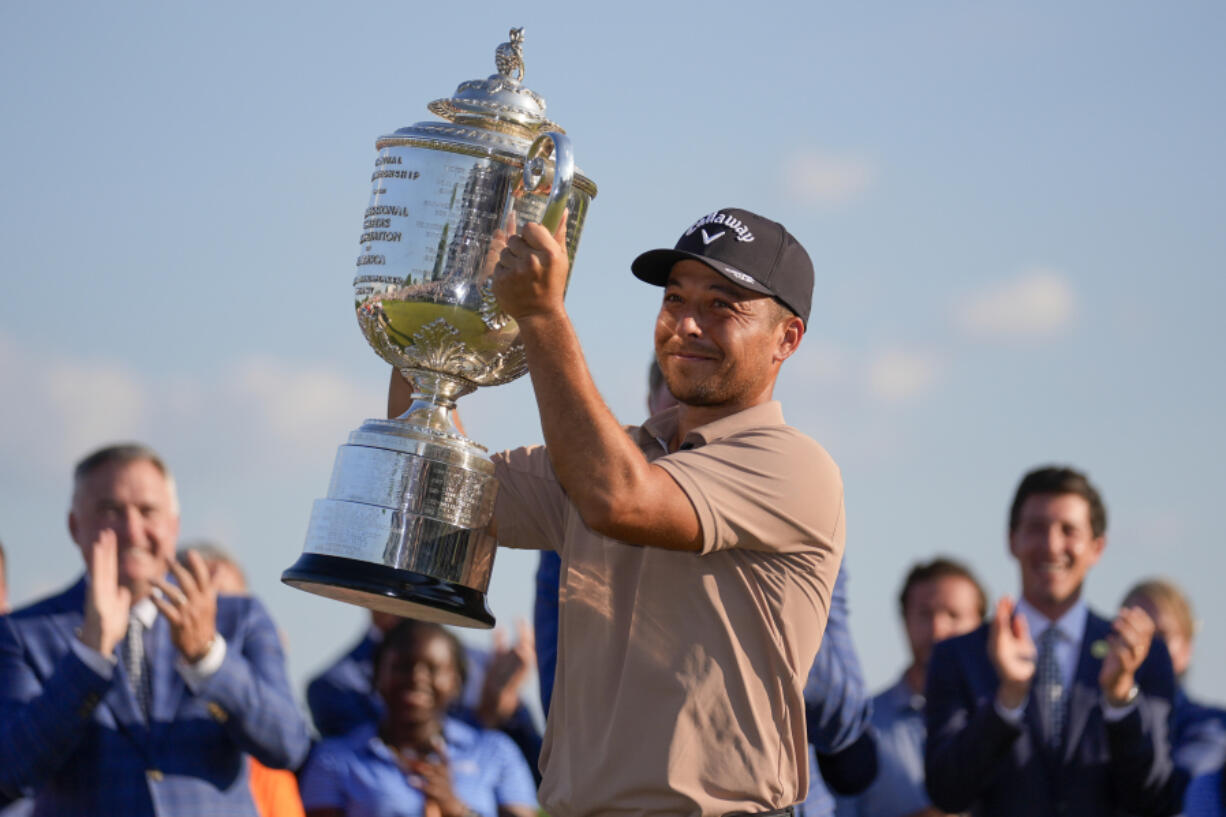 Xander Schauffele holds the Wanamaker trophy after winning the PGA Championship golf tournament at the Valhalla Golf Club, Sunday, May 19, 2024, in Louisville, Ky.