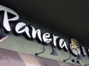 FILE - A Panera Bread sign and logo is attached to the outside of a Panera Bread restaurant location in the Studio City section of Los Angeles, on Thursday, March 7, 2024. Panera Bread said Tuesday, May 7, it&rsquo;s discontinuing its Charged Sips drinks that were tied to at least two wrongful death lawsuits due to their high caffeine content.