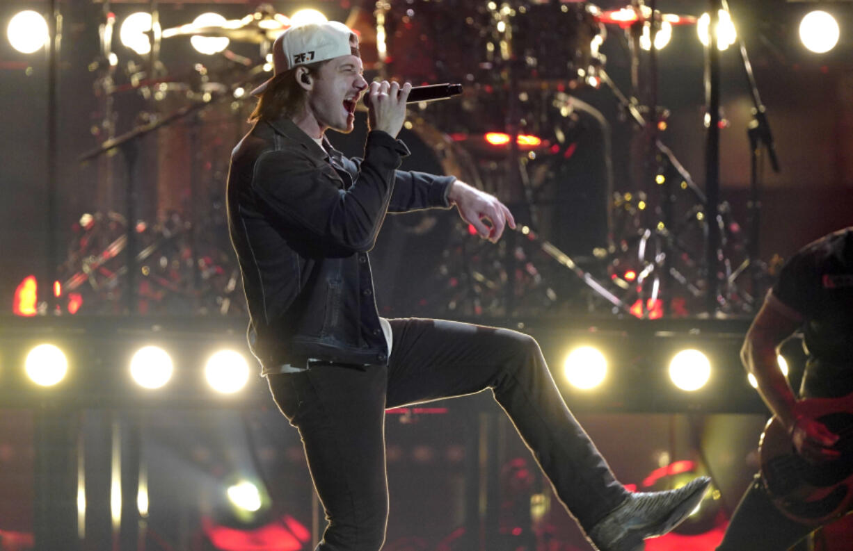 FILE - Morgan Wallen performs during the 56th annual CMA Awards, Nov. 9, 2022, at the  in Nashville, Tenn. On Tuesday, May 21, 2024, Nashville councilmembers rejected plans for a glowing sign at Wallen&rsquo;s new bar along the city&rsquo;s neon-lit strip of honky tonks, citing his use of a racial slur publicized in 2021 and his recent criminal charges of throwing a chair off a rooftop and nearly hitting two police officers.