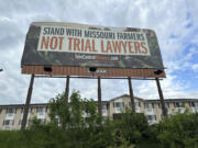 A billboard supporting legislation that would provide legal protection to manufacturers of pesticides such as Bayer&rsquo;s popular weedkiller Roundup, is shown in Jefferson City, Mo., on May 13, 2024. (AP Photo/David A.