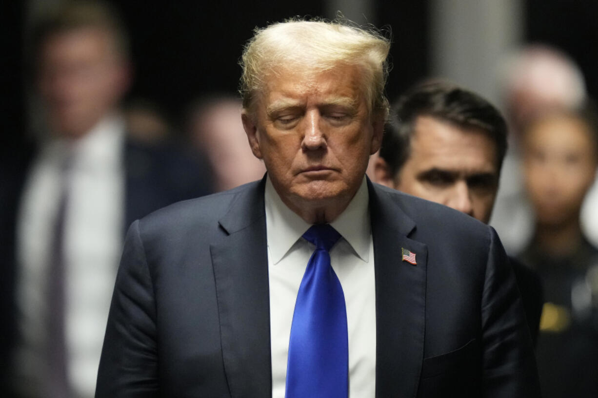 Former President Donald Trump walks to make comments to members of the media after a jury convicted him of felony crimes for falsifying business records in a scheme to illegally influence the 2016 election, at Manhattan Criminal Court, Thursday, May 30, 2024, in New York.