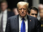 Former President Donald Trump walks to make comments to members of the media after a jury convicted him of felony crimes for falsifying business records in a scheme to illegally influence the 2016 election, at Manhattan Criminal Court, Thursday, May 30, 2024, in New York.