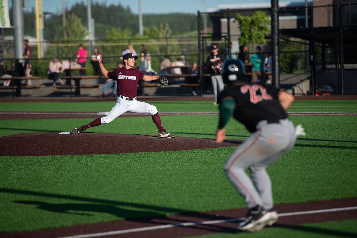 Ridgefield Raptors pitcher Travis Gibson, a Washougal High grad and Clark College pitcher, delivers against the Cowlitz Black Bears during an exhibition game Thursday, May 30, 2024, at Ridgefield Outdoor Athletic Complex.