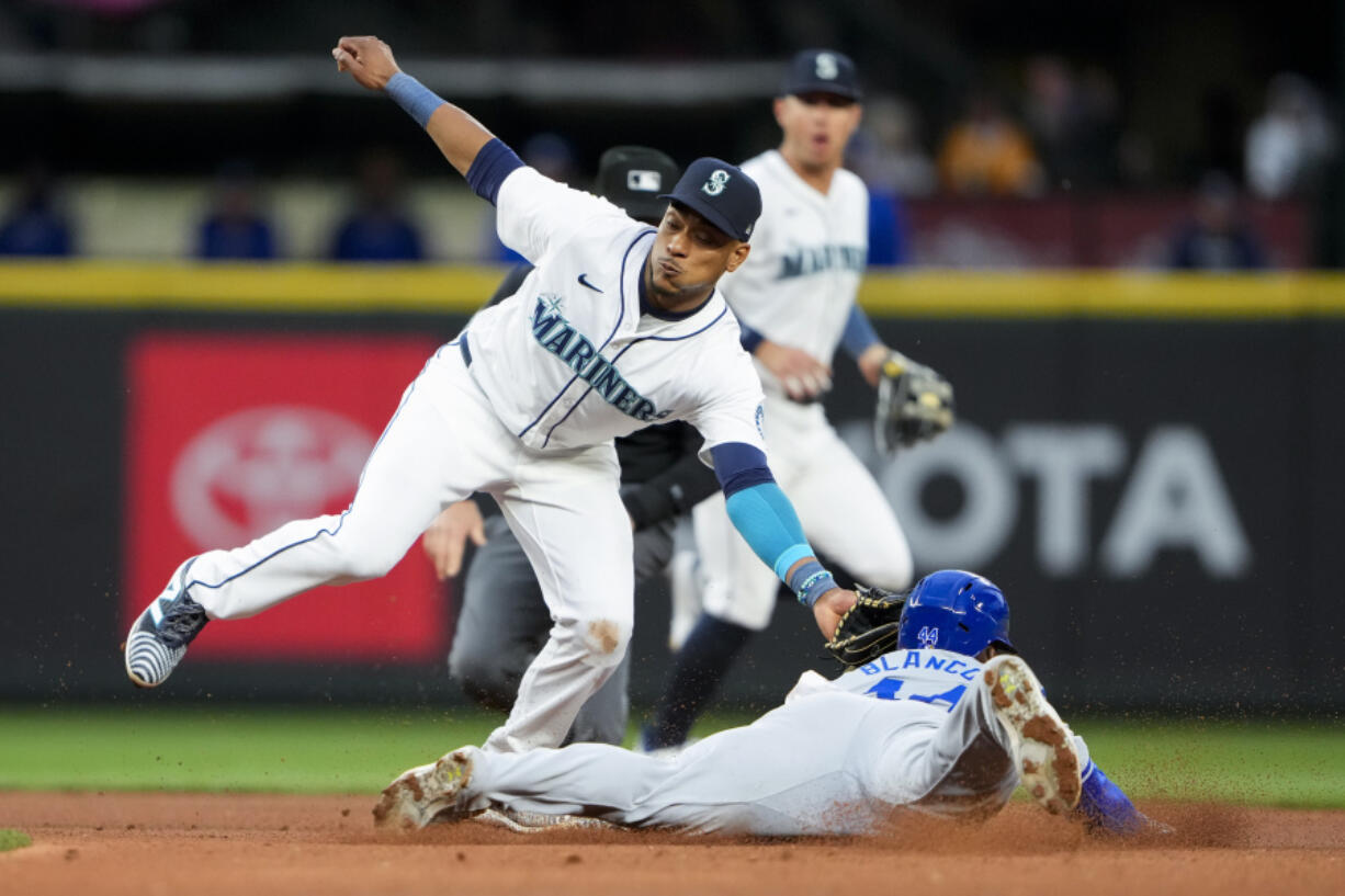 Seattle Mariners second baseman Jorge Polanco tags out Kansas City Royals&#039; Dairon Blanco attempting to steal second base during the fifth inning of a baseball game Monday, May 13, 2024, in Seattle.