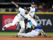 Seattle Mariners second baseman Jorge Polanco tags out Kansas City Royals&#039; Dairon Blanco attempting to steal second base during the fifth inning of a baseball game Monday, May 13, 2024, in Seattle.