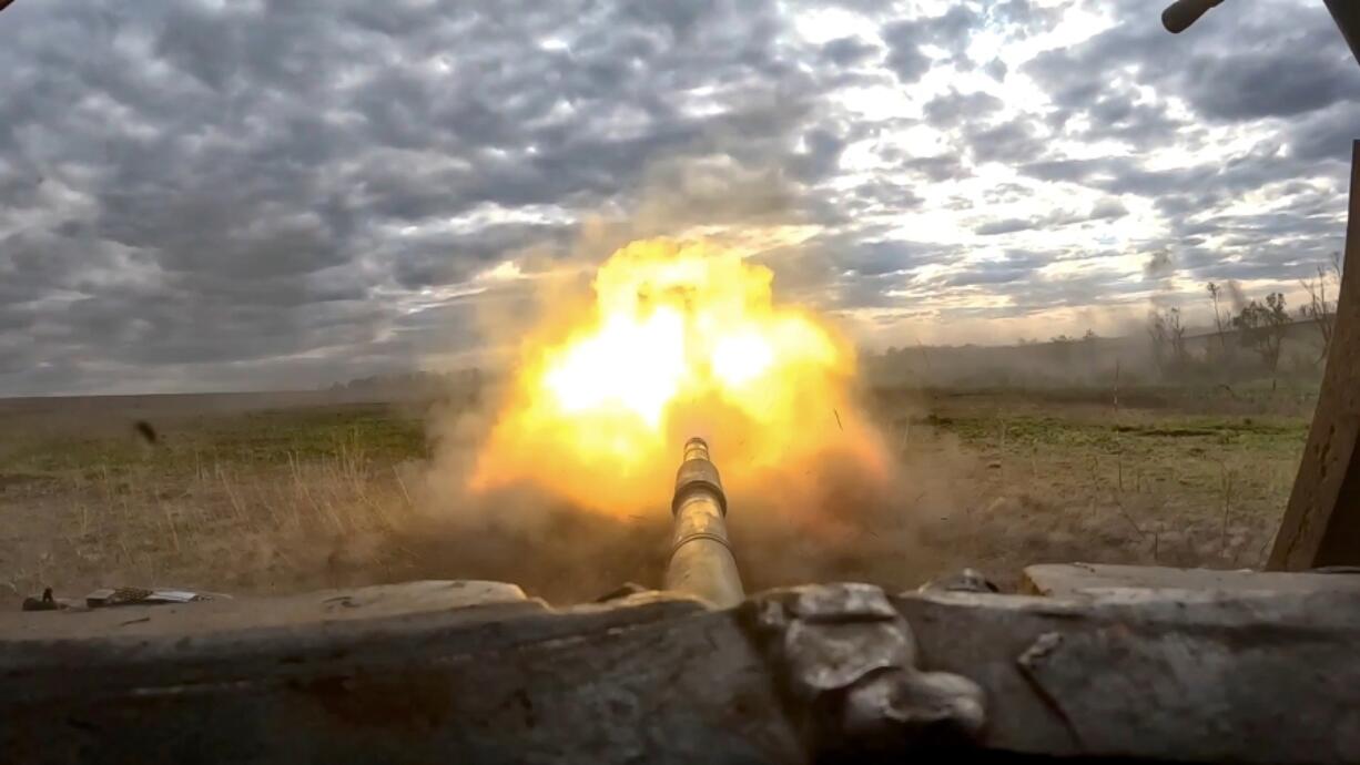This photo taken from video released by the Russian Defense Ministry Press Service on Tuesday, May 21, 2024, shows as Russian tank T-90 fires in an undisclosed location in Ukraine.
