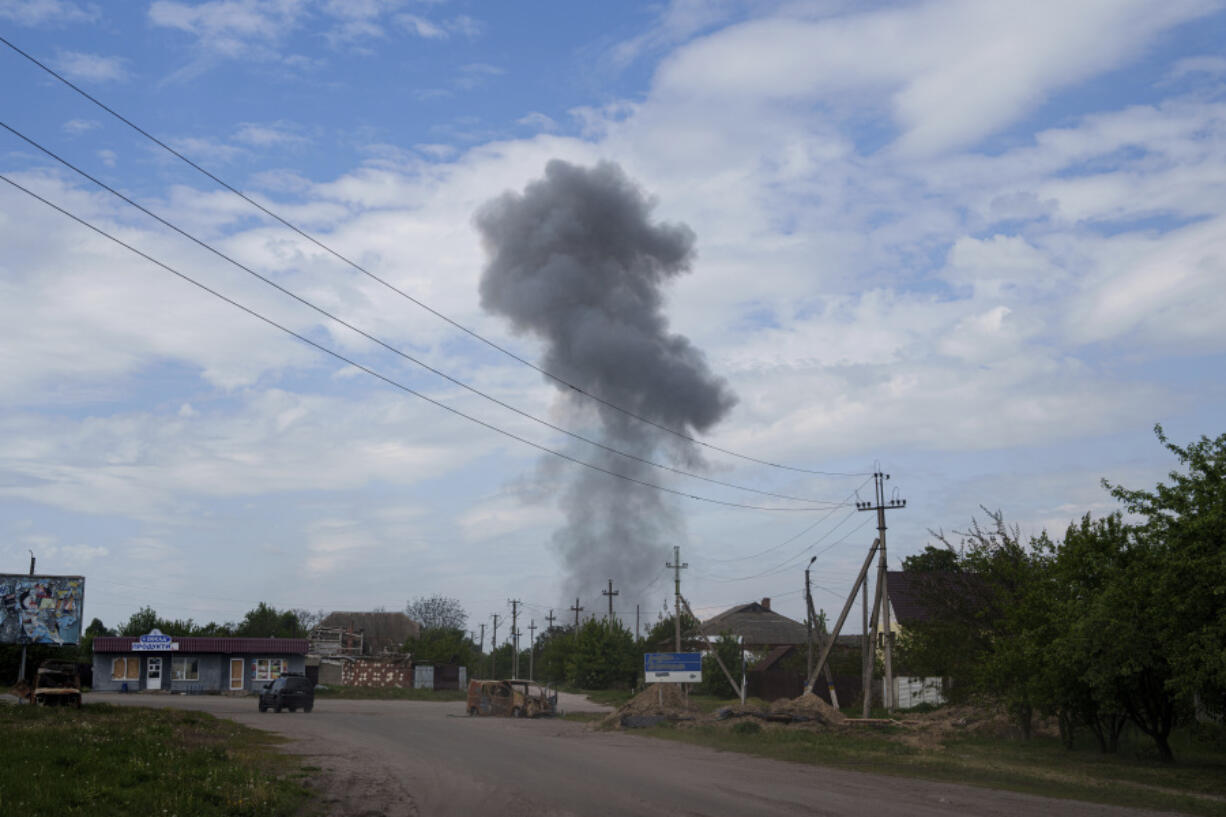 Smoke rises over the houses after a Russian airstrike on a residential neighbourhood in Vovchansk, Ukraine, on Saturday, May 11, 2024.