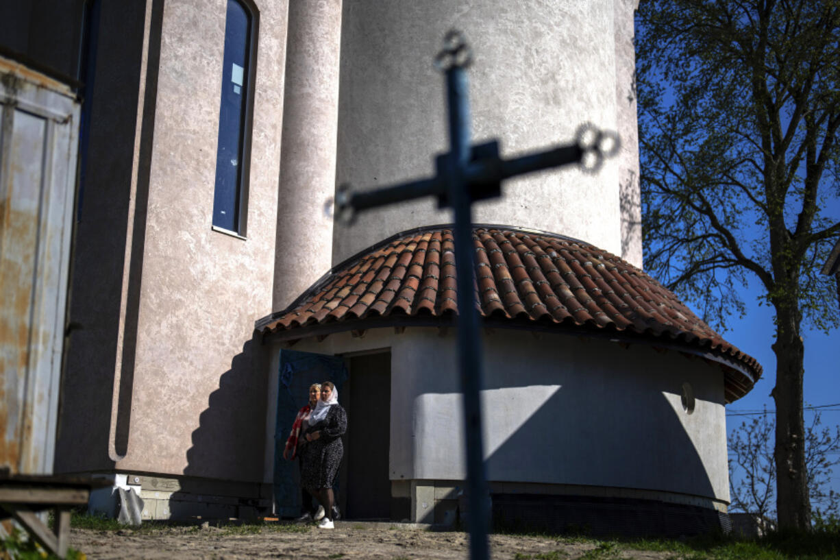 Christian Orthodox worshippers leave the chapel basement after attending a service at the Church of the Intercession of the Blessed Virgin Mary in, Lypivka, near Lviv, Ukraine, Sunday, April 28, 2024. This Orthodox Easter season, an extraordinary new church is bringing spiritual comfort to war-weary residents of the Ukrainian village of Lypivka. Two years ago it also provided physical refuge from horrors outside.