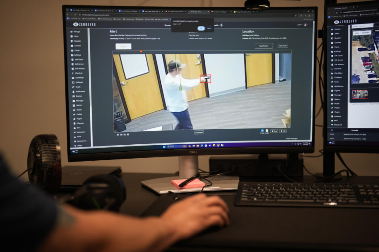 ZeroEyes analyst Mario Hernandez demonstrates the use of artificial intelligence with surveillance cameras to identify visible guns at the company&#039;s operations center, Friday, May 10, 2024, in Conshohocken, Pa.