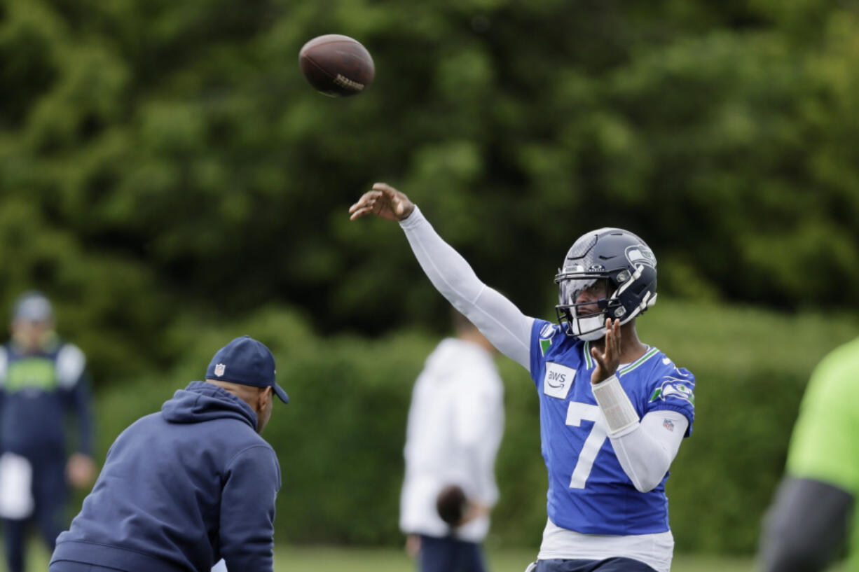 Seattle Seahawks quarterback Geno Smith throws a pass during an NFL football practice, Wednesday, May 22, 2024, in Renton, Wash.