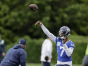 Seattle Seahawks quarterback Geno Smith throws a pass during an NFL football practice, Wednesday, May 22, 2024, in Renton, Wash.