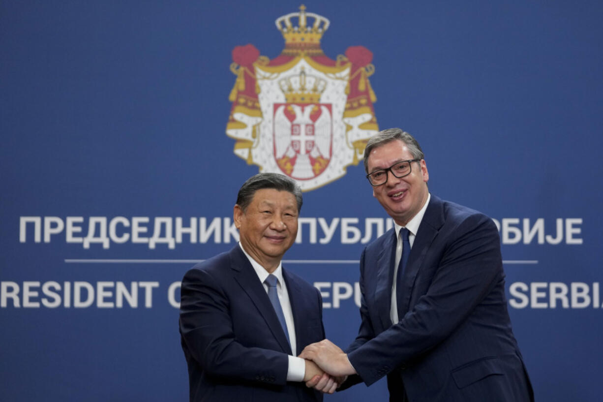 Chinese President Xi Jinping shakes hands with Serbian President Aleksandar Vucic at the Serbia Palace in Belgrade, Serbia, Wednesday, May 8, 2024.