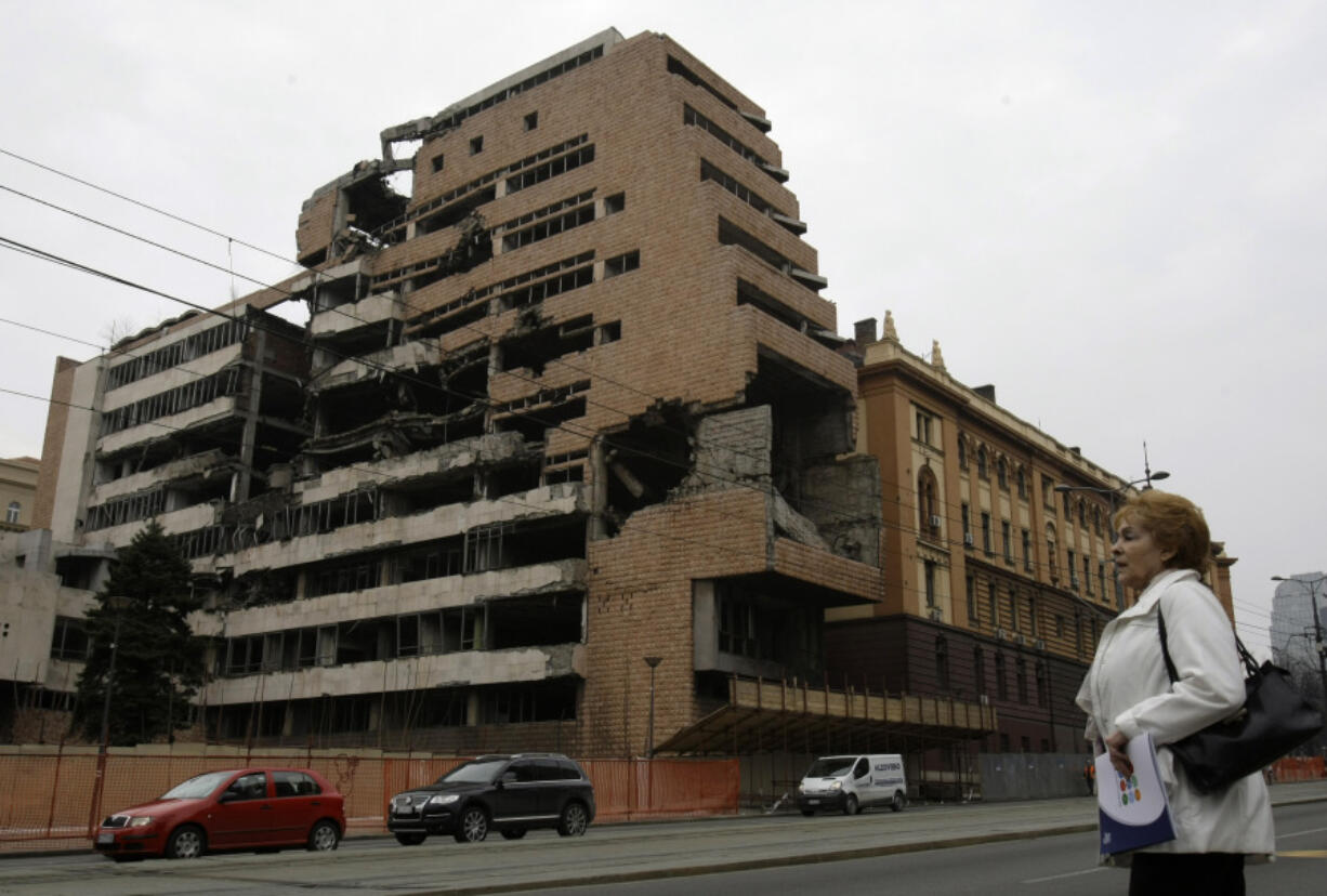 FILE- A woman walks in front of the destroyed former Serbian army headquarters in Belgrade, Serbia, March 24, 2010. Opposition groups in Serbia are planning protests against a real estate development project that will be financed by the firm of Donald Trump&rsquo;s son-in-law, Jared Kushner, at the site of the former Serbian army headquarters destroyed in a U.S.-led NATO bombing campaign in 1999. The Serbian government earlier this week signed a deal with a Kushner-related company for the 99-year lease of land in central Belgrade for the &ldquo;revitalization&rdquo; of the bombed-out buildings.