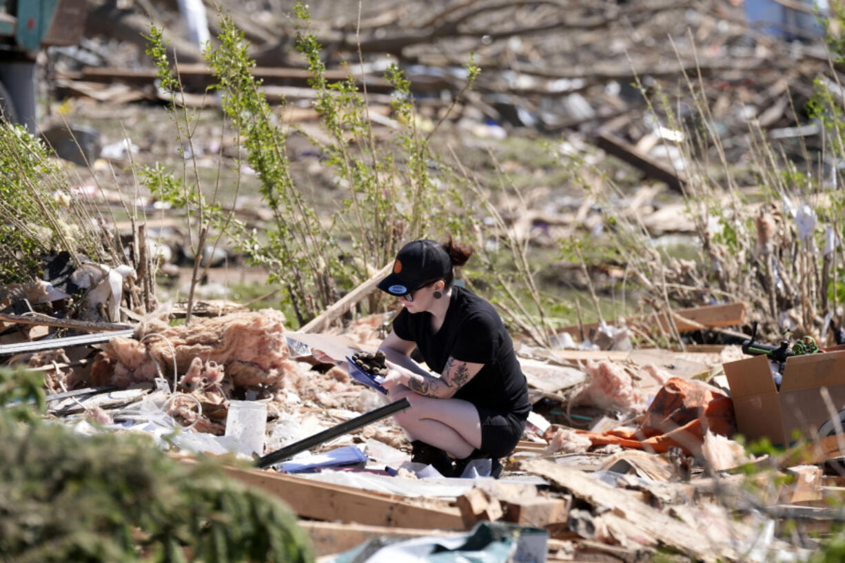 Jena Wiggins looks to recover items from her husband&rsquo;s grandparents&rsquo; tornado-damaged home, Thursday, May 23, 2024, in Greenfield, Iowa.