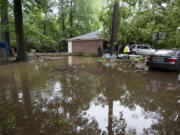 In addition to a tree from a neighbor&rsquo;s yard falling on their south Jackson, Miss., house, heavy rain caused flooding around the home of the Brown-Rankin family, May 13, 2024.