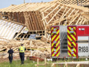 Magnolia Fire officials investigate the scene of a collapsed house that resulted in a fatality on Tuesday, May 28, 2024 in Magnolia, Texas.  One construction worker was killed when the frames of two single-family homes that were under construction fell as a strong, fast-moving storm moved across Montgomery County, officials said.