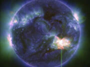 This image provided by NASA shows a solar flare, as seen in the bright flash in the lower right,  captured by NASA&rsquo;s Solar Dynamics Observatory on May 9, 2024. A severe geomagnetic storm watch has been issued for Earth starting Friday and lasting all weekend  _ the first in nearly 20 years.