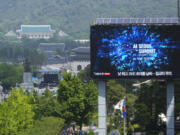 A screen shows an announcement of the AI Seoul Summit in Seoul, South Korea, Tuesday, May 21, 2024. World leaders are expected to adopt a new agreement on artificial intelligence when they gather virtually Tuesday to discuss AI&rsquo;s potential risks but also ways to promote its benefits and innovation.