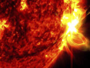 This image provided by NASA&rsquo;s Solar Dynamics Observatory shows a solar flare, right, on May 14, 2024, captured in the extreme ultraviolet light portion of the spectrum colorized in red and yellow. An international team of mathematicians and scientists reported Wednesday, May 22, 2024, that the sun&rsquo;s magnetic field originates much closer to the surface than previously thought.